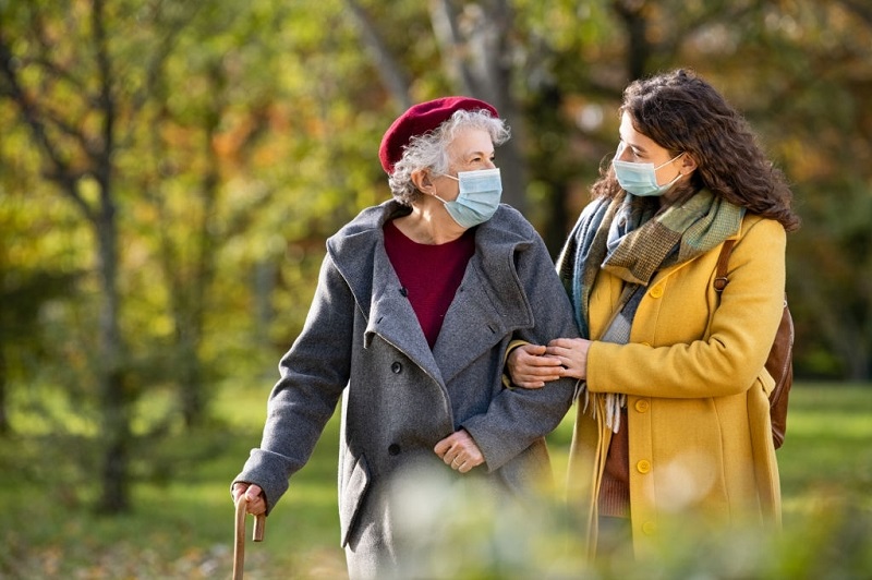 caregiver taking care of a lady