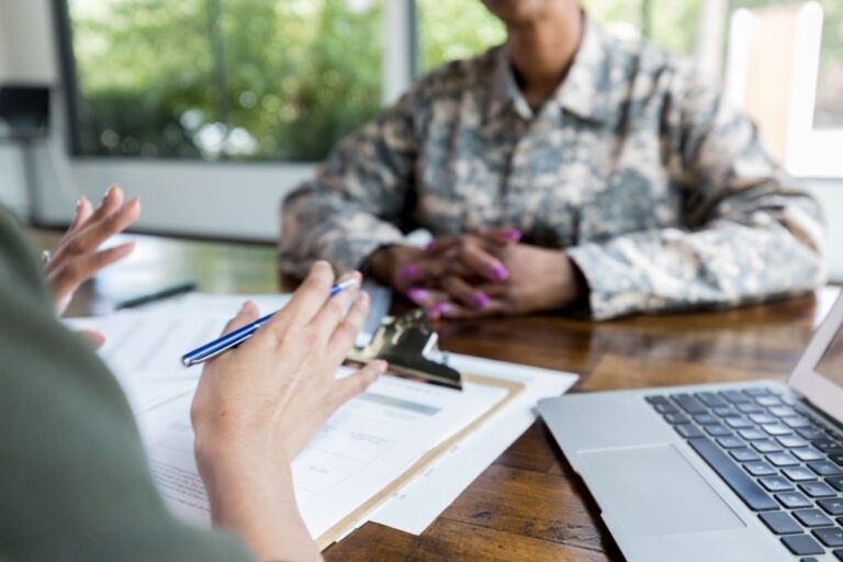advisor talking with veteran about loans