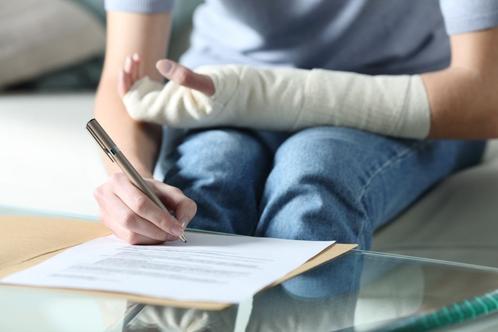 Disabled person writing a disability applicaiton letter